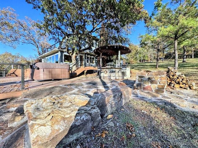 view of yard with a deck and a bar