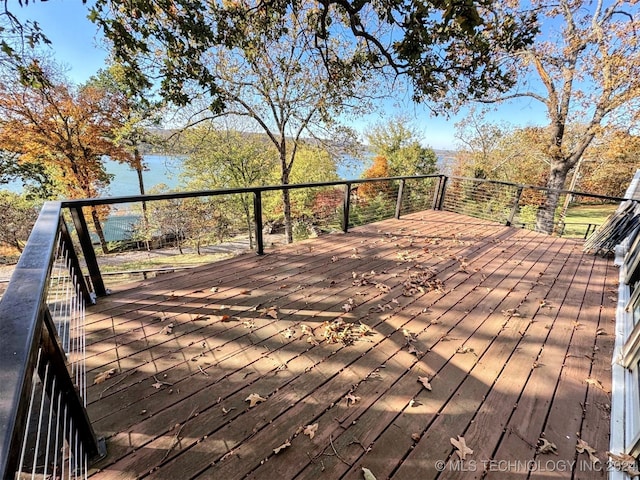 wooden deck with a water view