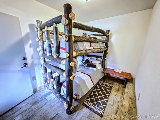 bedroom featuring hardwood / wood-style flooring