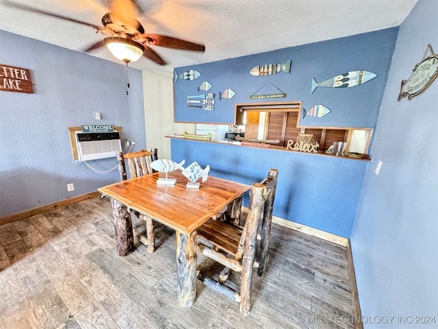 dining space featuring ceiling fan and wood-type flooring