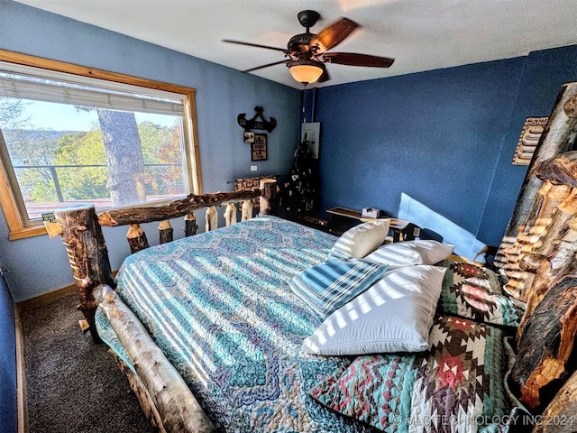 bedroom featuring ceiling fan and carpet floors