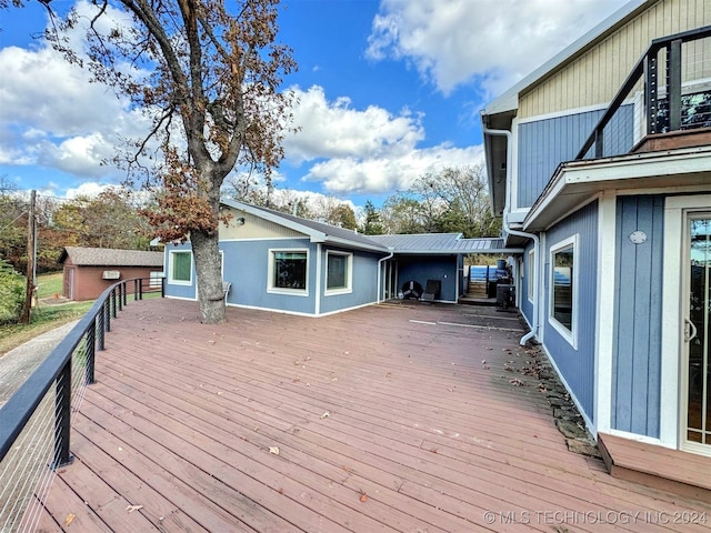 wooden deck with an outdoor structure