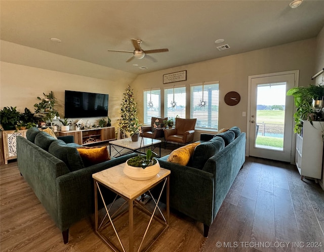 living room featuring hardwood / wood-style floors and ceiling fan