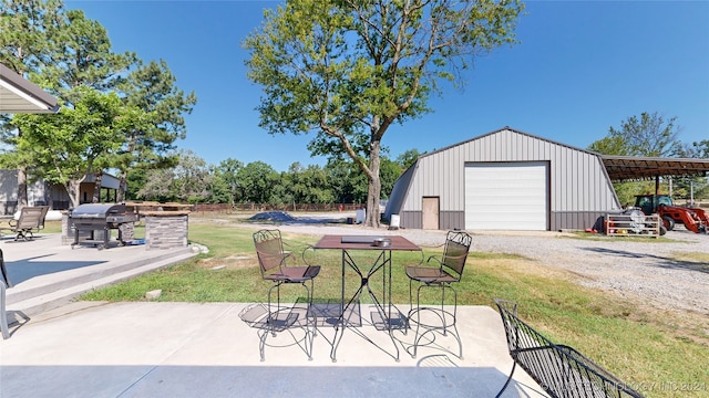 garage featuring a yard and a carport