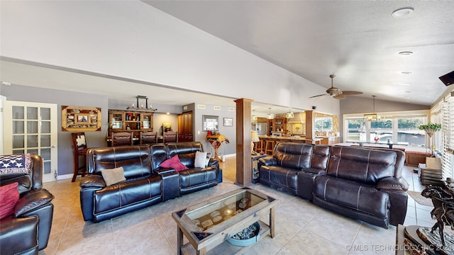 tiled living room featuring ceiling fan, ornate columns, and vaulted ceiling