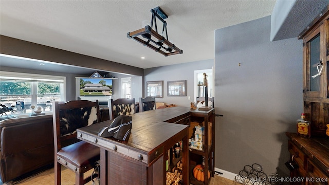 dining room featuring a textured ceiling