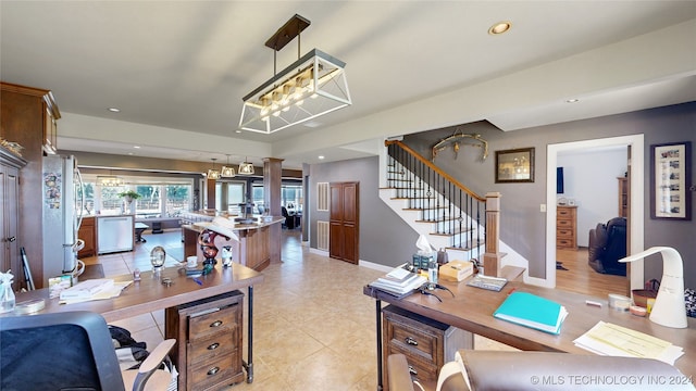 tiled home office featuring an inviting chandelier