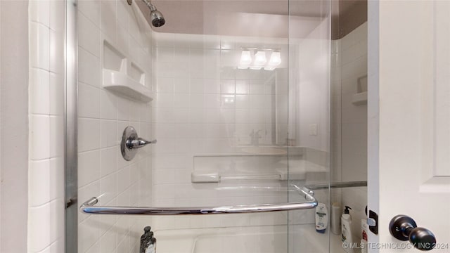 bathroom with an enclosed shower