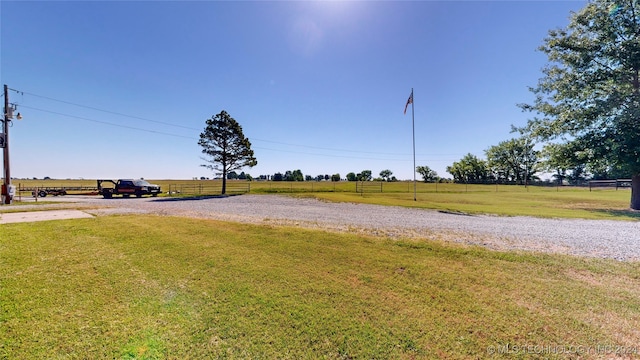 view of yard with a rural view