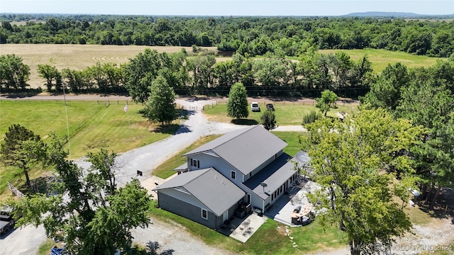 birds eye view of property with a rural view