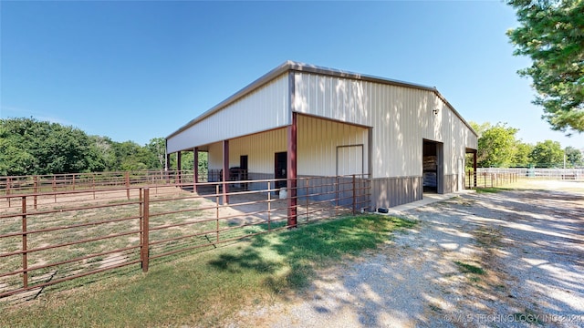 view of stable with a rural view