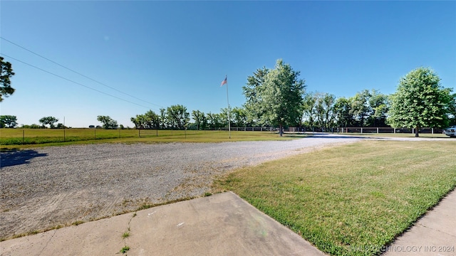 view of yard with a rural view