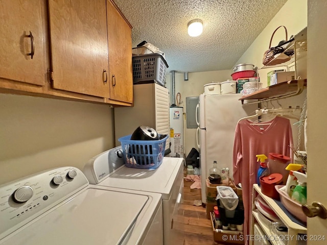 613 S Rodgers St, Vian, OK 74962 - laundry room with washer and clothes dryer, a textured ceiling, cabinet space, gas water heater, and wood finished floors