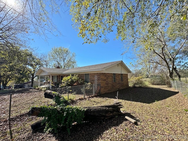 613 S Rodgers St, Vian, OK 74962 - view of side of property featuring brick siding