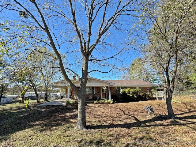 single story home with a carport