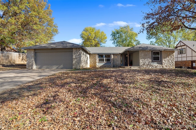 single story home featuring a garage