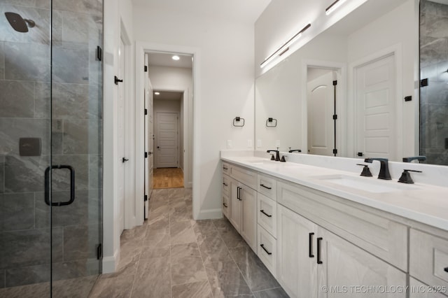 bathroom with vanity and walk in shower