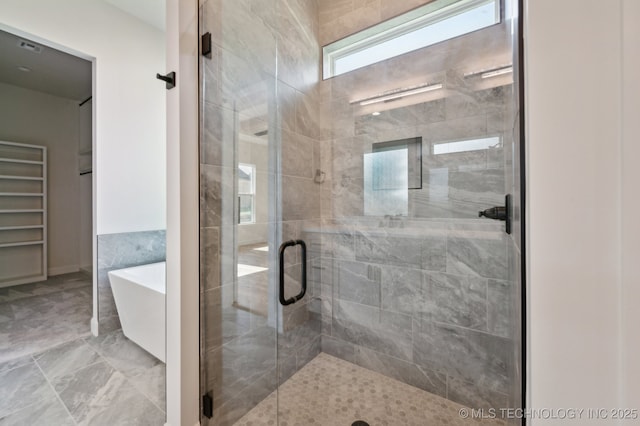 bathroom with independent shower and bath