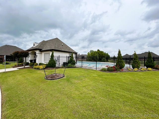 exterior space featuring a fenced in pool