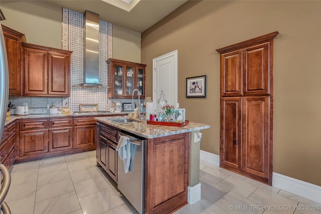 kitchen featuring sink, wall chimney range hood, light stone counters, stainless steel dishwasher, and an island with sink