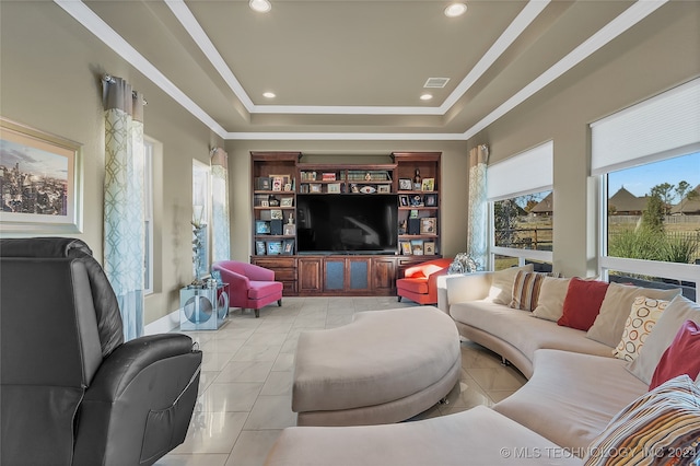 tiled living room featuring a raised ceiling and crown molding