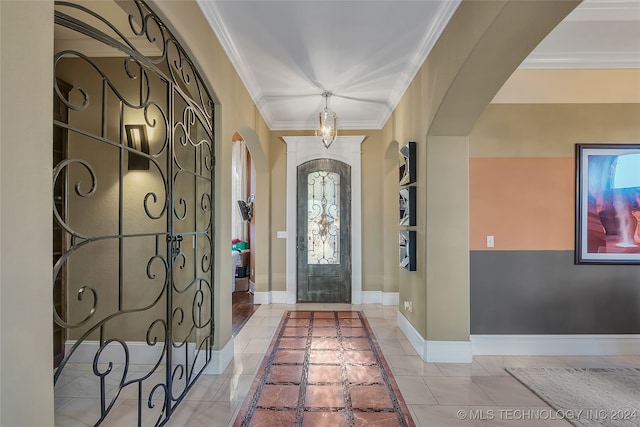 tiled foyer with crown molding