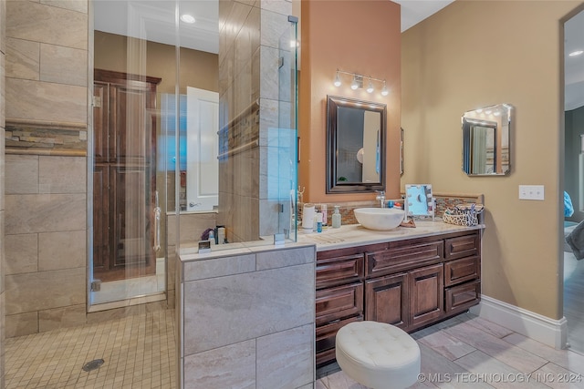 bathroom with tile patterned flooring, vanity, and an enclosed shower