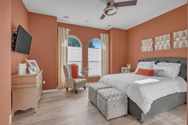 bedroom with light wood-type flooring and ceiling fan