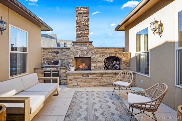 view of patio / terrace featuring an outdoor living space with a fireplace