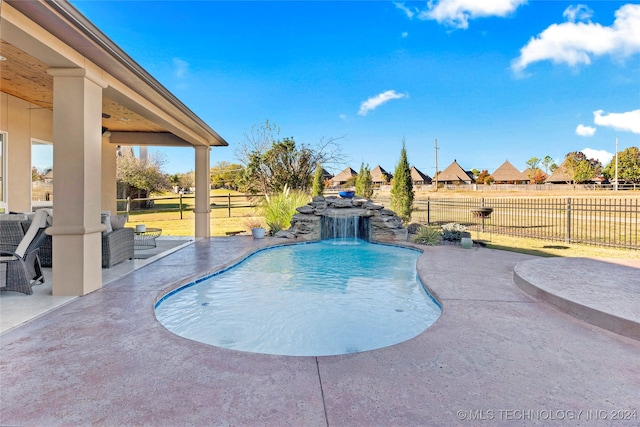 view of pool featuring a patio area and pool water feature