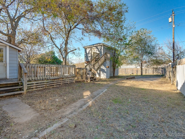 view of yard with a wooden deck