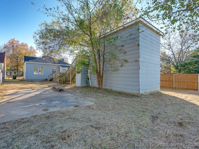 rear view of house featuring a patio