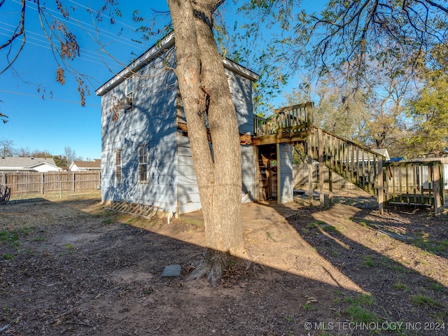 back of property with a wooden deck