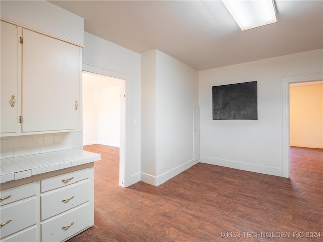 spare room featuring hardwood / wood-style floors