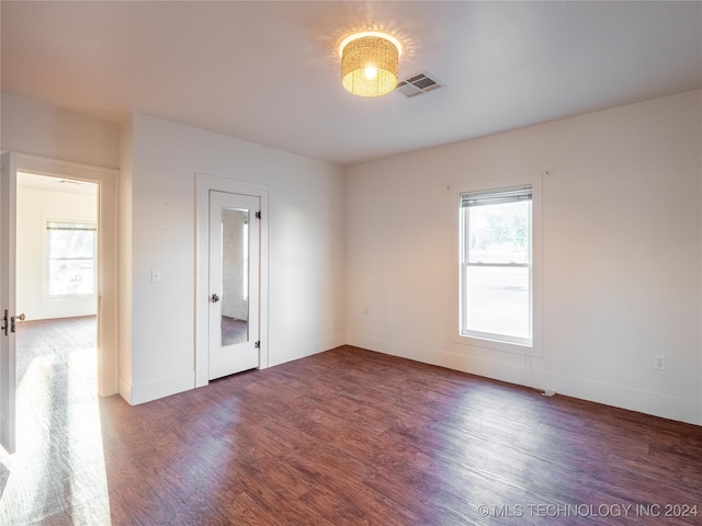 empty room featuring wood-type flooring