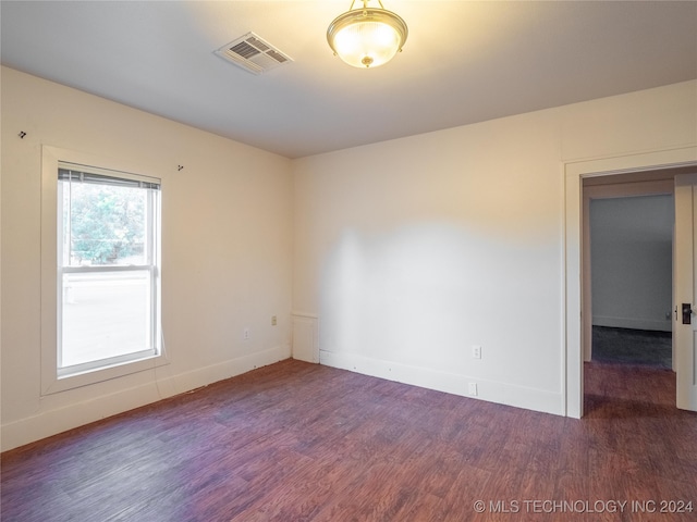 empty room featuring dark hardwood / wood-style floors