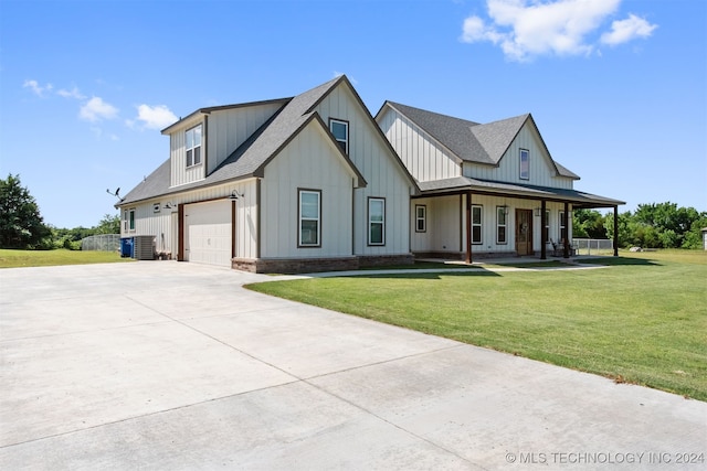 modern inspired farmhouse with a porch, a garage, and a front lawn