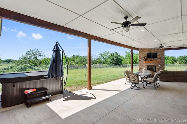 view of patio / terrace featuring an outdoor brick fireplace and ceiling fan