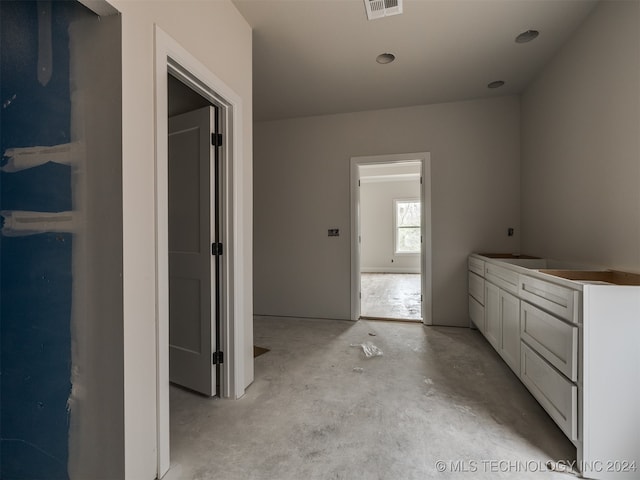 bathroom with concrete floors