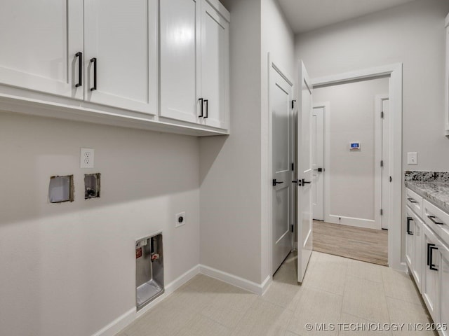 laundry room featuring cabinets, washer hookup, and hookup for an electric dryer