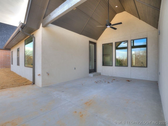 view of patio featuring ceiling fan