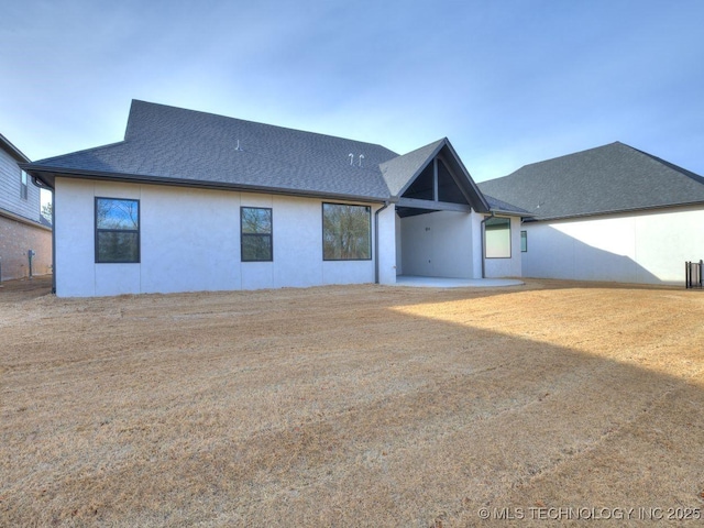 back of property with a patio area