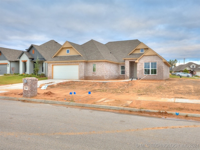 craftsman-style home with a garage