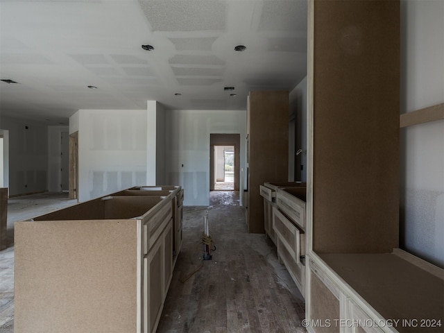 kitchen featuring dark hardwood / wood-style flooring and a center island