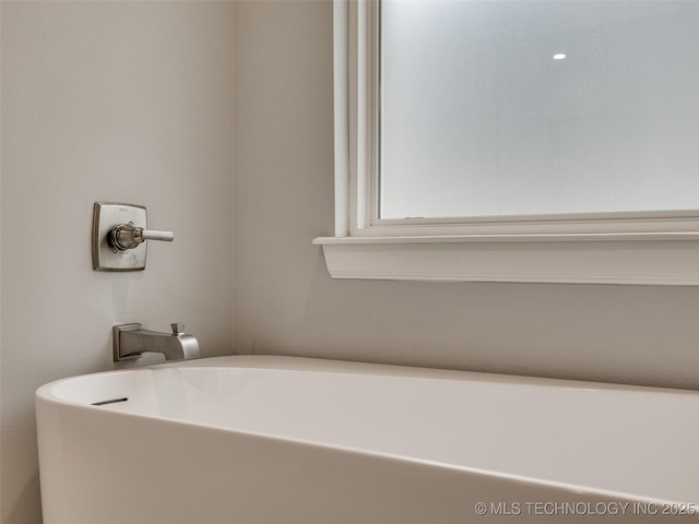 full bathroom with a soaking tub