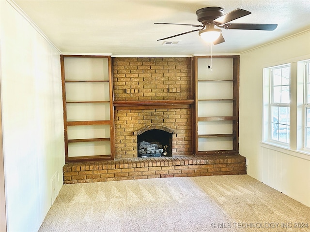 unfurnished living room with ceiling fan, a healthy amount of sunlight, light colored carpet, and a fireplace