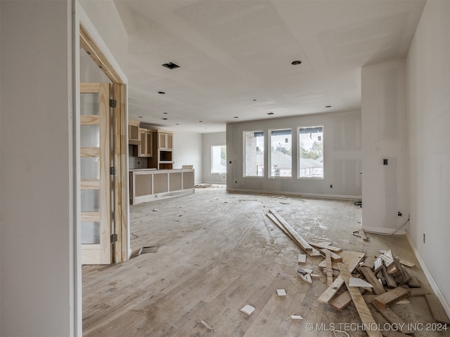 unfurnished living room featuring light wood-type flooring