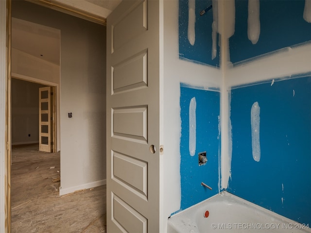 bathroom featuring a tub