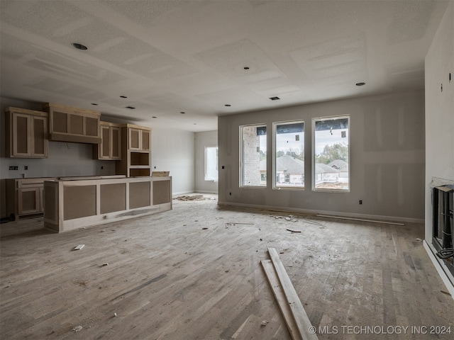 unfurnished living room with wood-type flooring