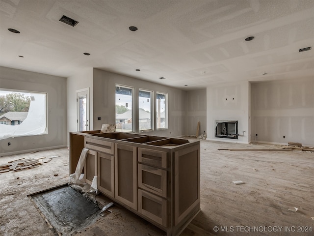 kitchen featuring a fireplace and a textured ceiling